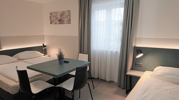 Economy Triple Room, 3 Twin Beds, Shared Bathroom | Hypo-allergenic bedding, minibar, blackout drapes, free WiFi
