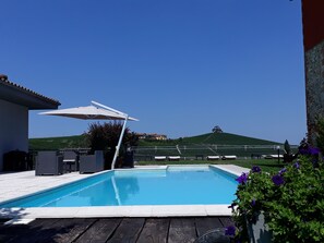 Outdoor pool, open 9:00 AM to 7:00 PM, pool loungers