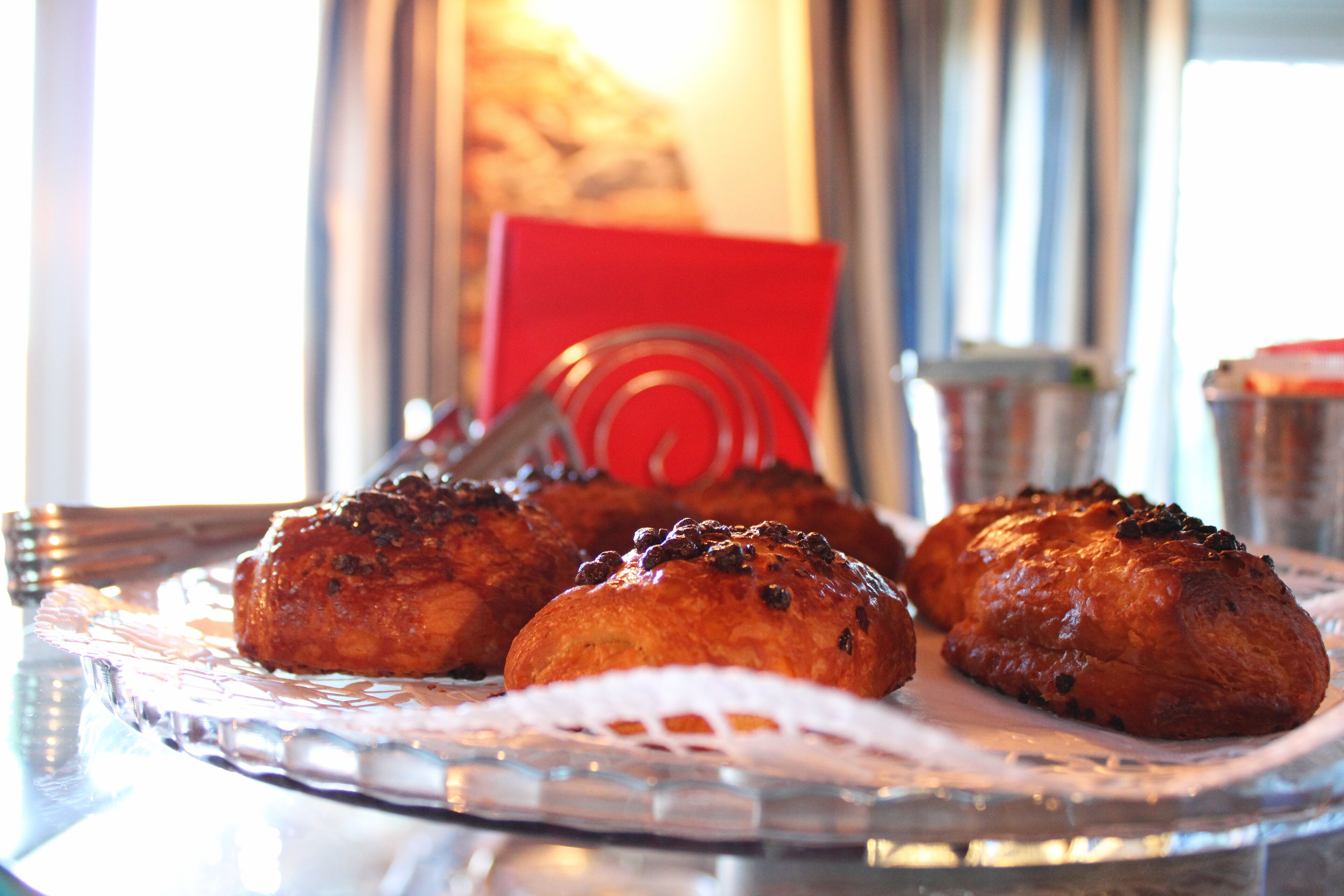 A tray of baked goods on a clear glass plate.