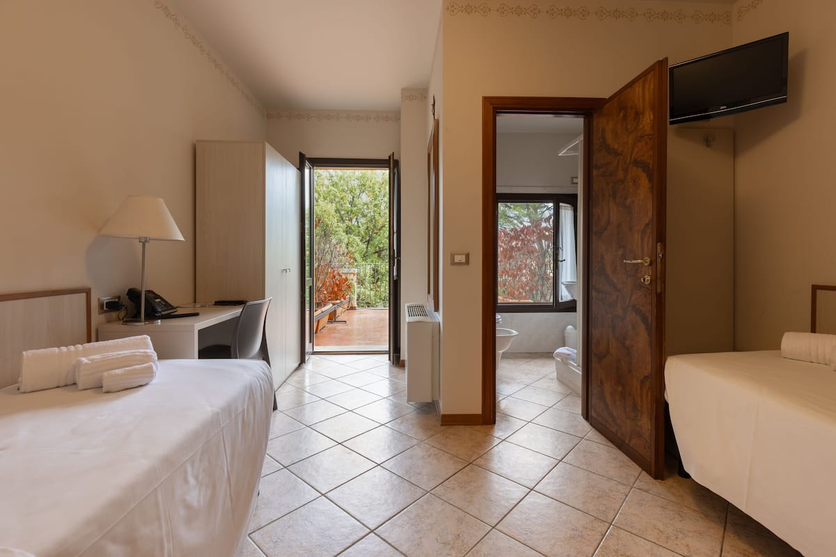 Twin Room, 2 Twin Beds, Balcony, Hill View | In-room safe, desk, laptop workspace, iron/ironing board