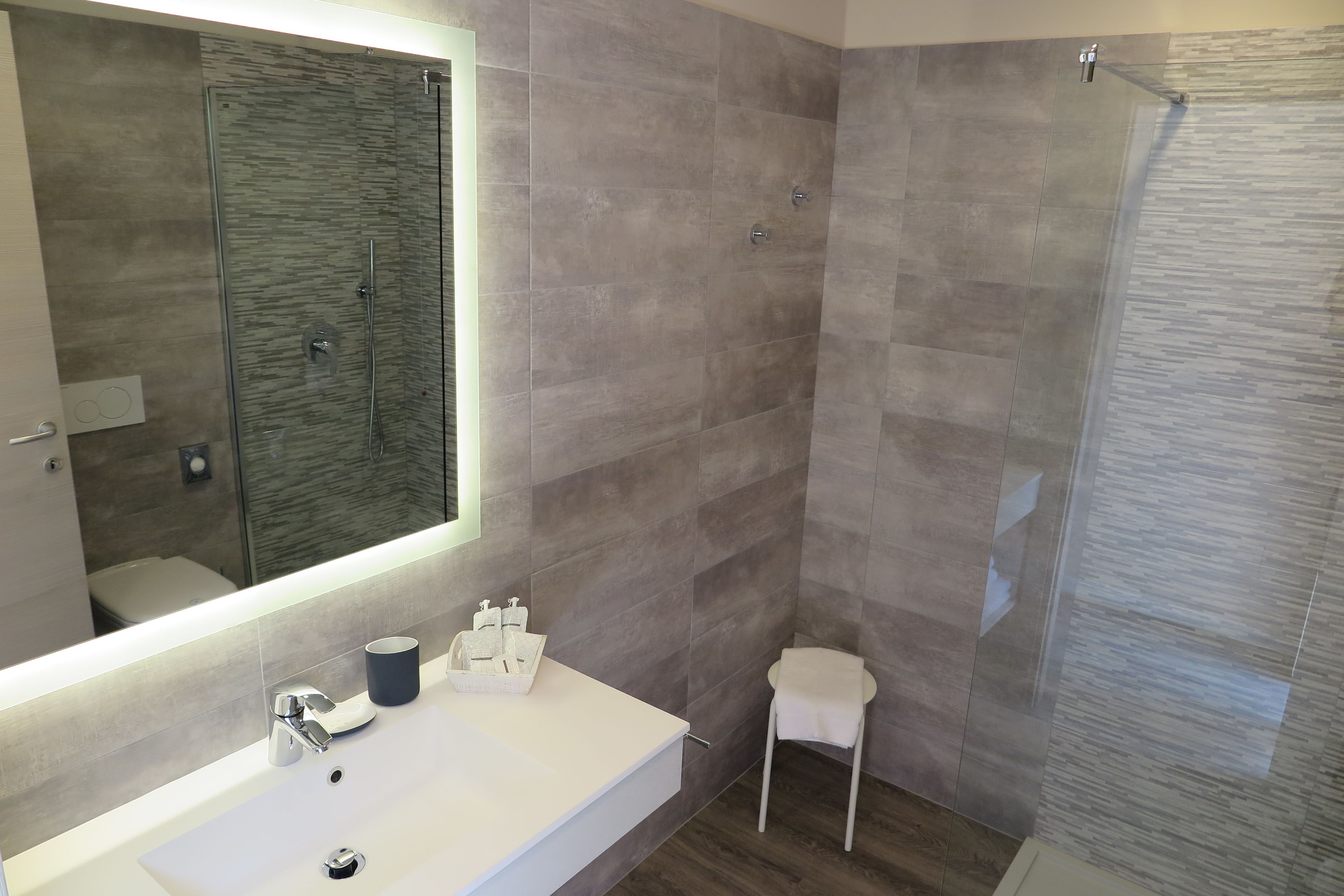 superior double room | bathroom | shower, rainfall showerhead, hair dryer, bidet