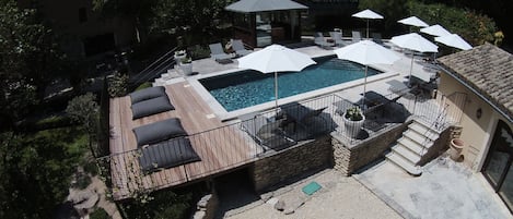Seasonal outdoor pool, pool umbrellas, pool loungers