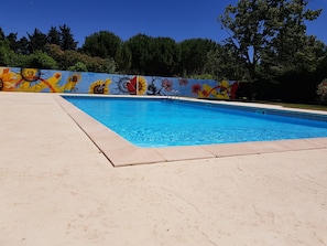 Seasonal outdoor pool, pool loungers