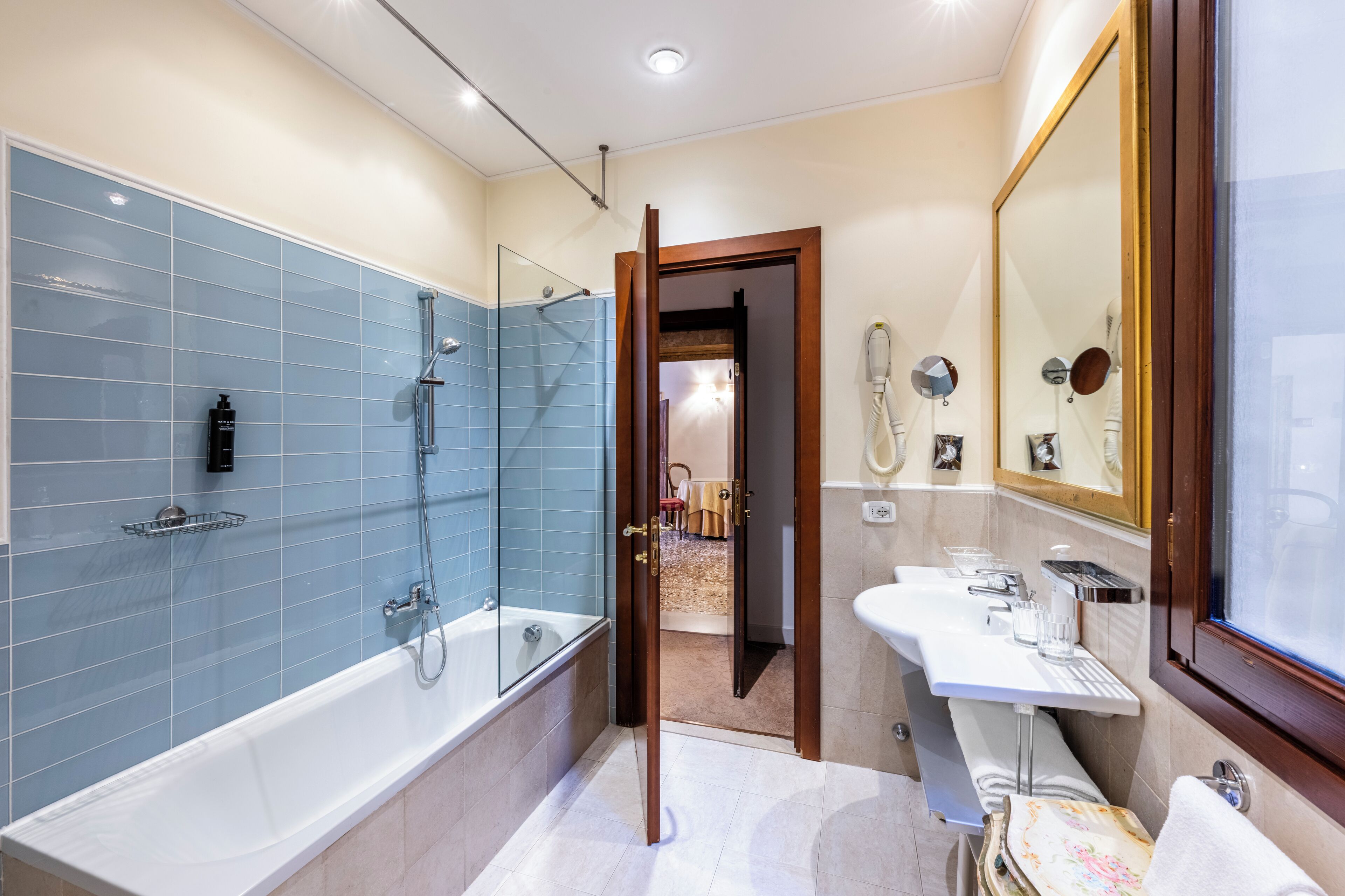 deluxe quadruple room | bathroom | free toiletries, hair dryer, towels, soap