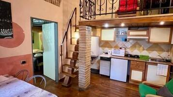 Family Loft, 1 Bedroom | Private kitchen | Fridge, stovetop, electric kettle, cookware/dishes/utensils