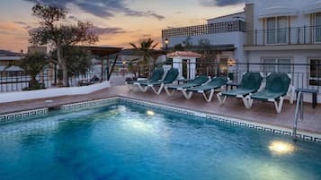 Seasonal outdoor pool, open 9:00 AM to 7:30 PM, pool umbrellas