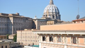 A historic building with classical architecture, including a prominent dome and detailed facade. - Le Suite di Via Ottaviano (Rome)