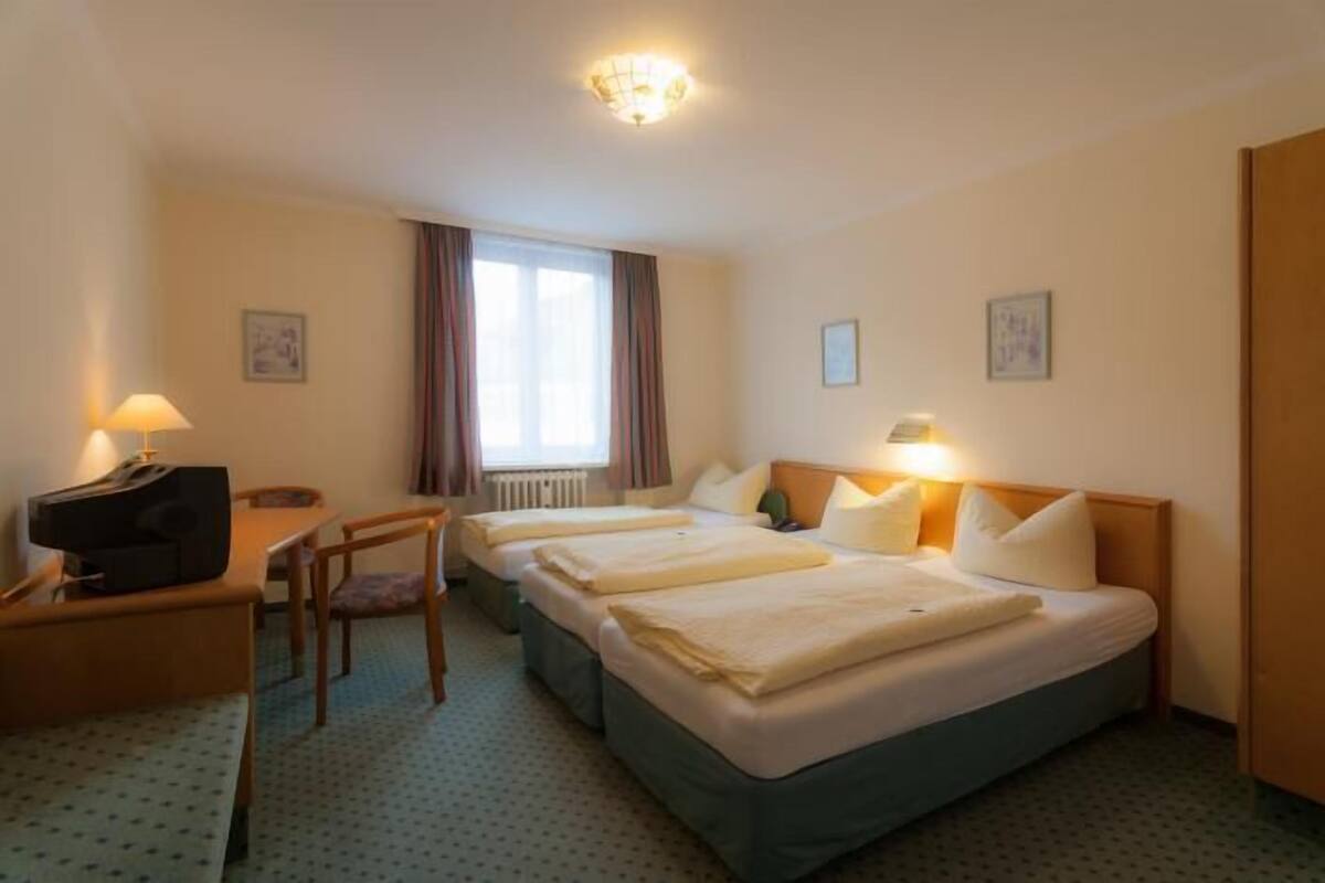 Triple Room | Minibar, in-room safe, desk, iron/ironing board