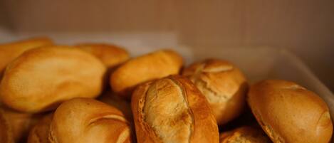 A tray of freshly baked bread rolls.