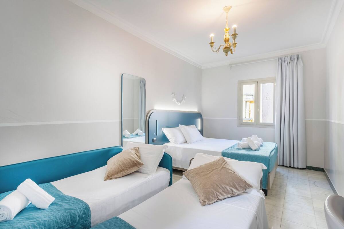 Classic Quadruple Room | Egyptian cotton sheets, down comforters, memory foam beds, in-room safe