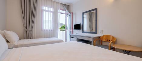 Standard Triple Room | Minibar, desk, iron/ironing board, free WiFi