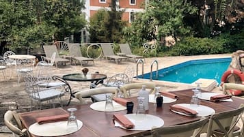Seasonal outdoor pool, open 8:00 AM to 8:00 PM, pool umbrellas