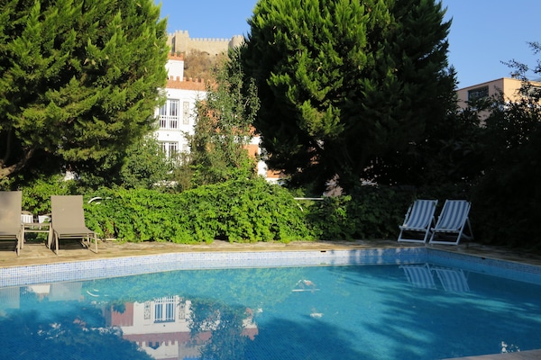 Seasonal outdoor pool, open 8:00 AM to 8:00 PM, pool umbrellas