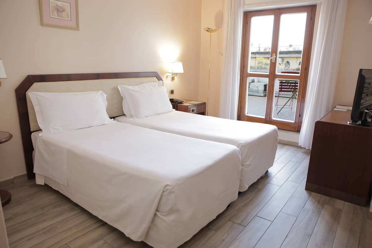Standard Twin Room | Minibar, in-room safe, desk, soundproofing