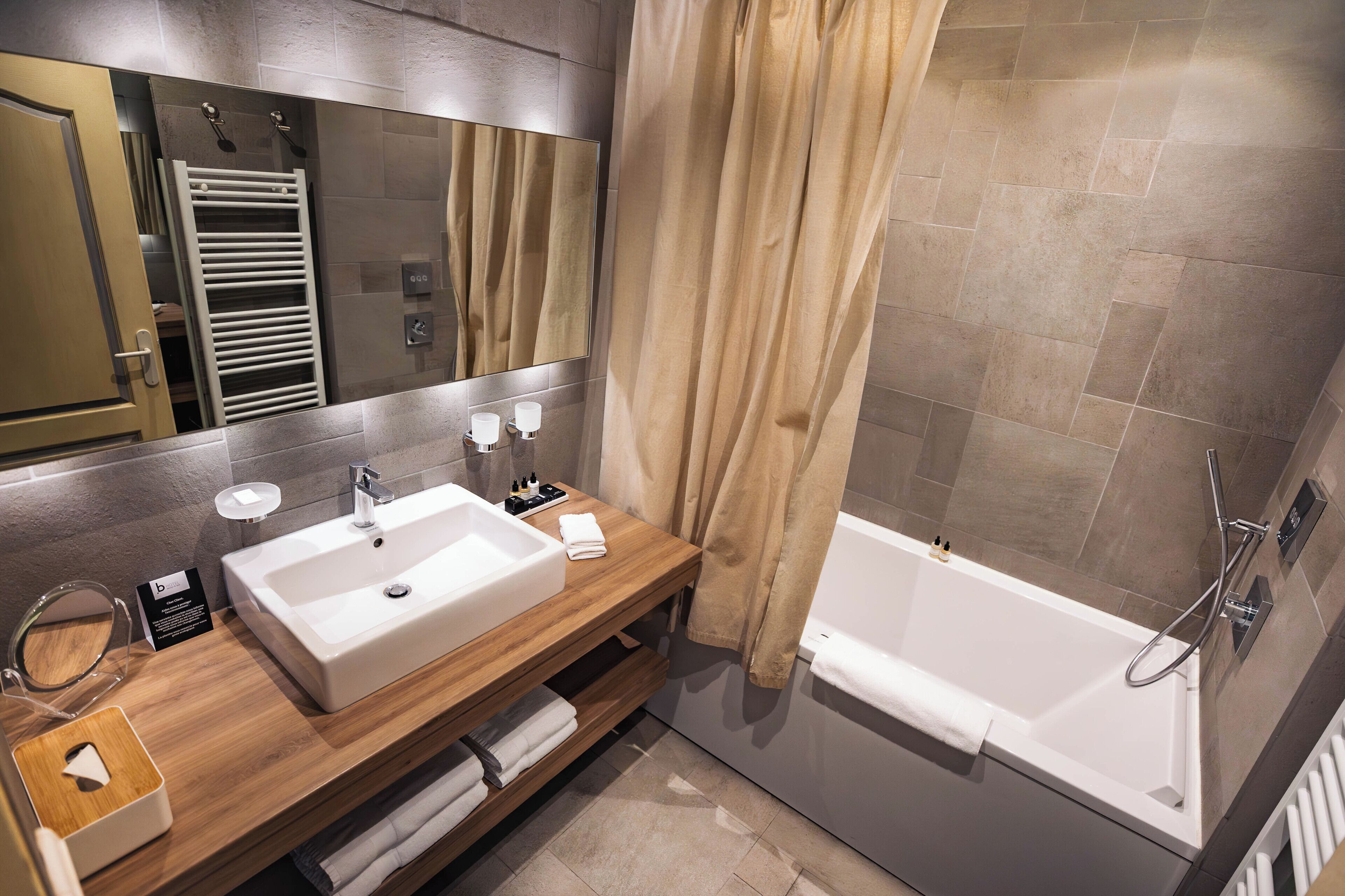 junior suite | bathroom | designer toiletries, hair dryer, bathrobes, slippers