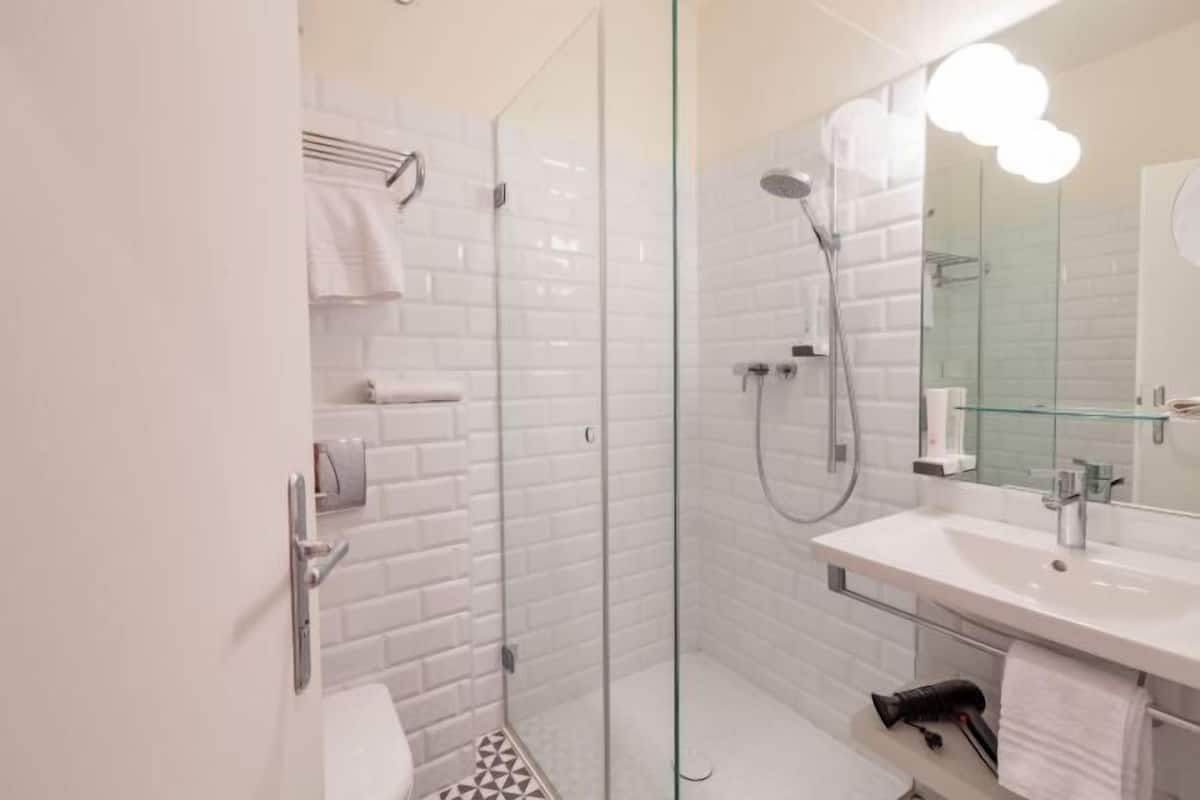 Bathroom | Free toiletries, hair dryer, slippers, towels