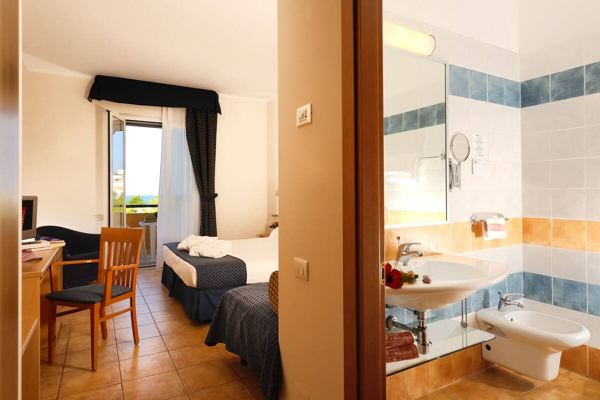 superior triple room | bathroom | free toiletries, hair dryer, bidet, towels