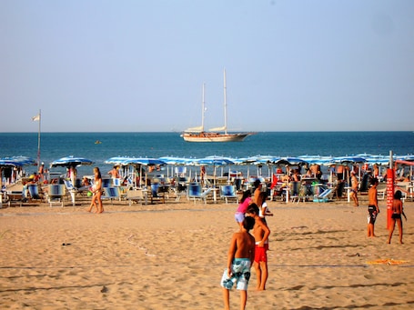 Private beach, beach cabanas, sun loungers, beach umbrellas. Hotel I Melograni