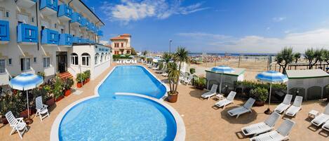 On the beach, beach shuttle, sun loungers, beach umbrellas