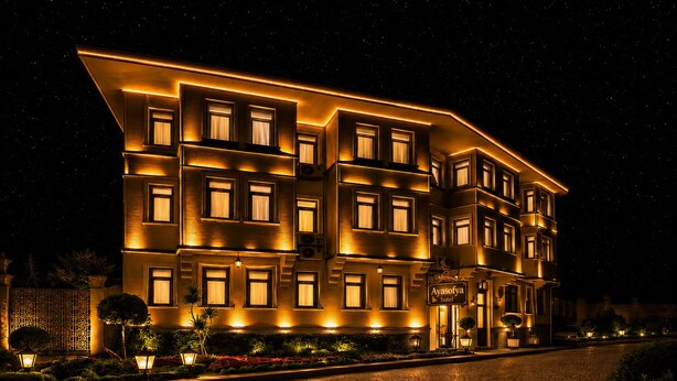 A multi-story hotel with illuminated windows and a sign reading 'Ayasofy Hotel.' - Ayasofya Hotel - Special Class (Istanbul)