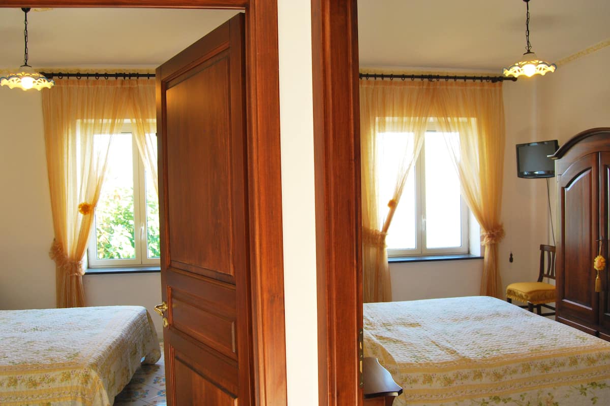 Quadruple Room | Pillow-top beds, desk, soundproofing, iron/ironing board