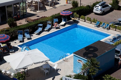 Seasonal outdoor pool, open 9:30 AM to 7:00 PM, pool umbrellas