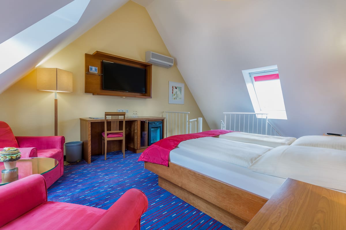 suite | hypo-allergenic bedding, desk, laptop workspace, blackout curtains