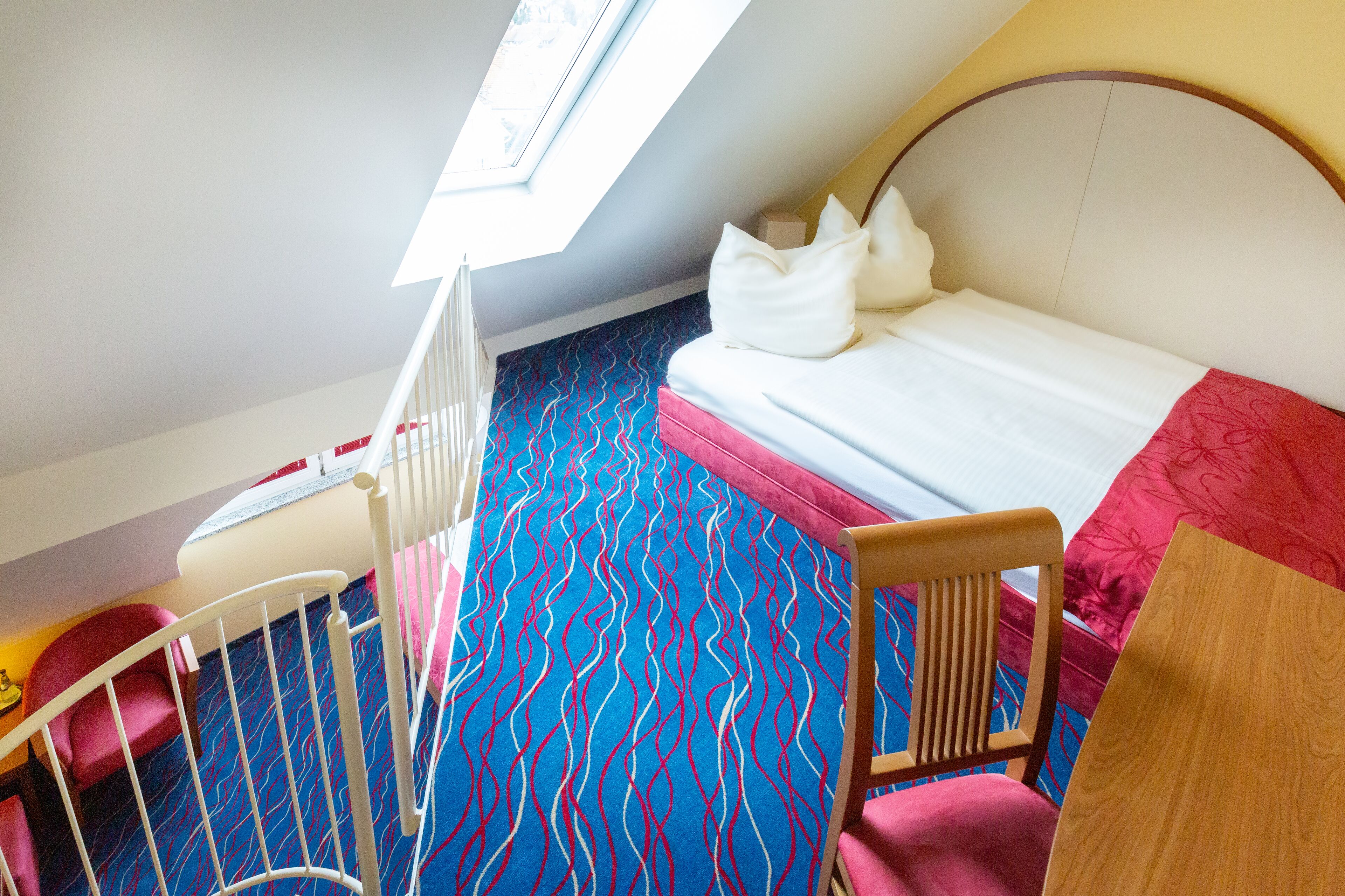 hypo-allergenic bedding, desk, laptop workspace, blackout curtains