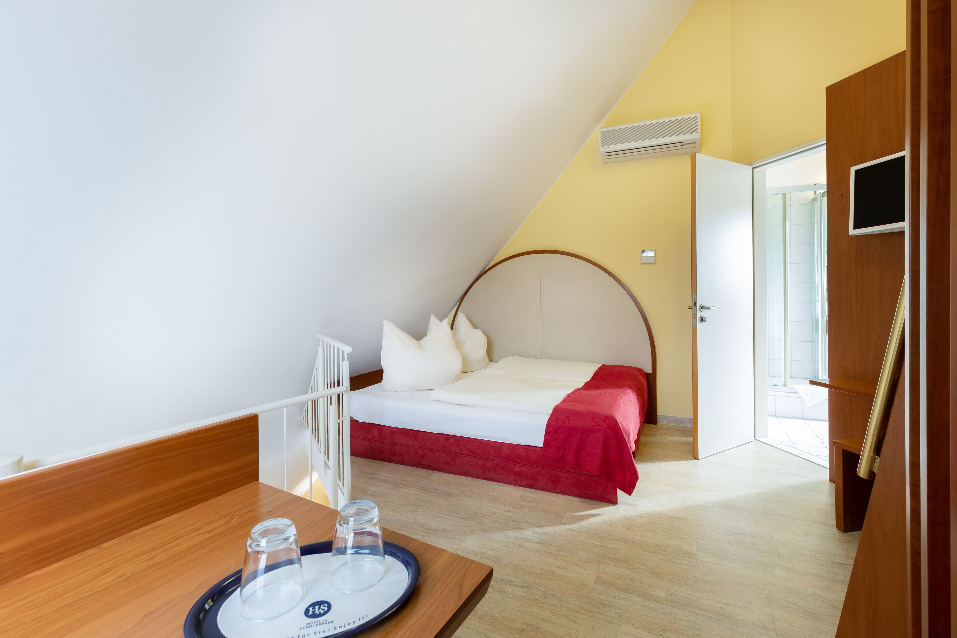 hypo-allergenic bedding, desk, laptop workspace, blackout curtains