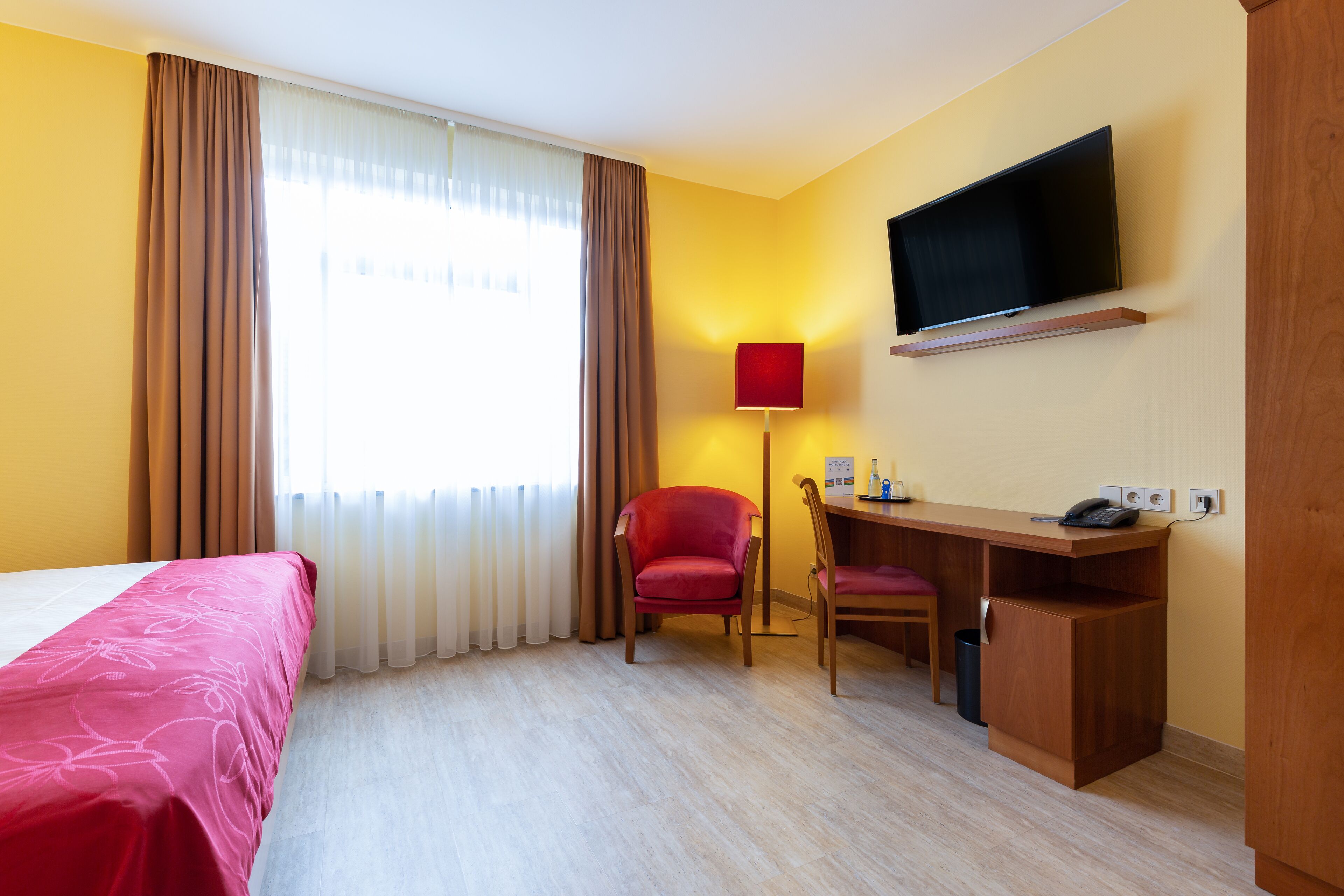 hypo-allergenic bedding, desk, laptop workspace, blackout curtains