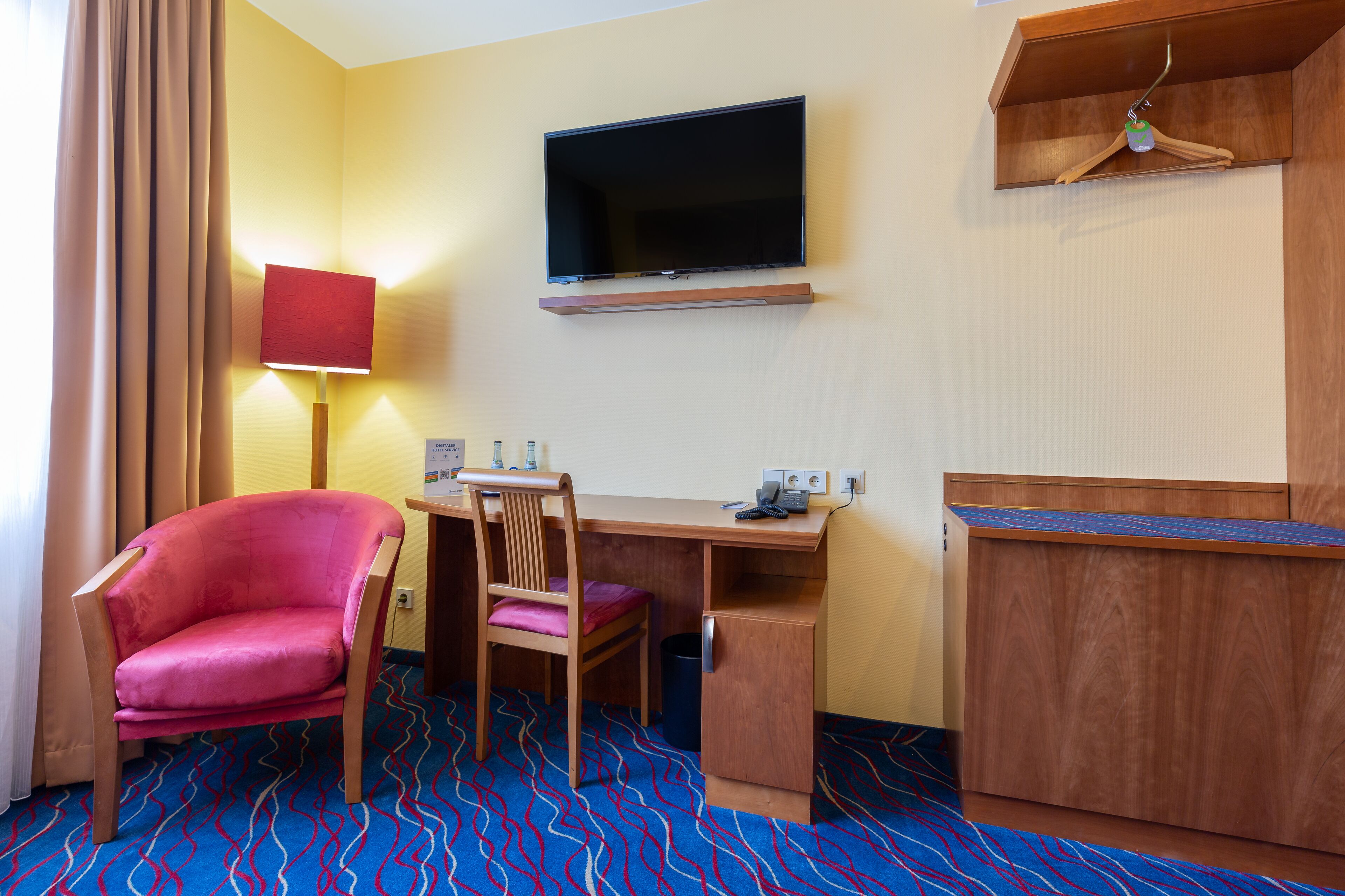 hypo-allergenic bedding, desk, laptop workspace, blackout curtains