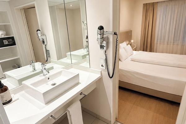 Deep soaking tub, rainfall showerhead, eco-friendly toiletries