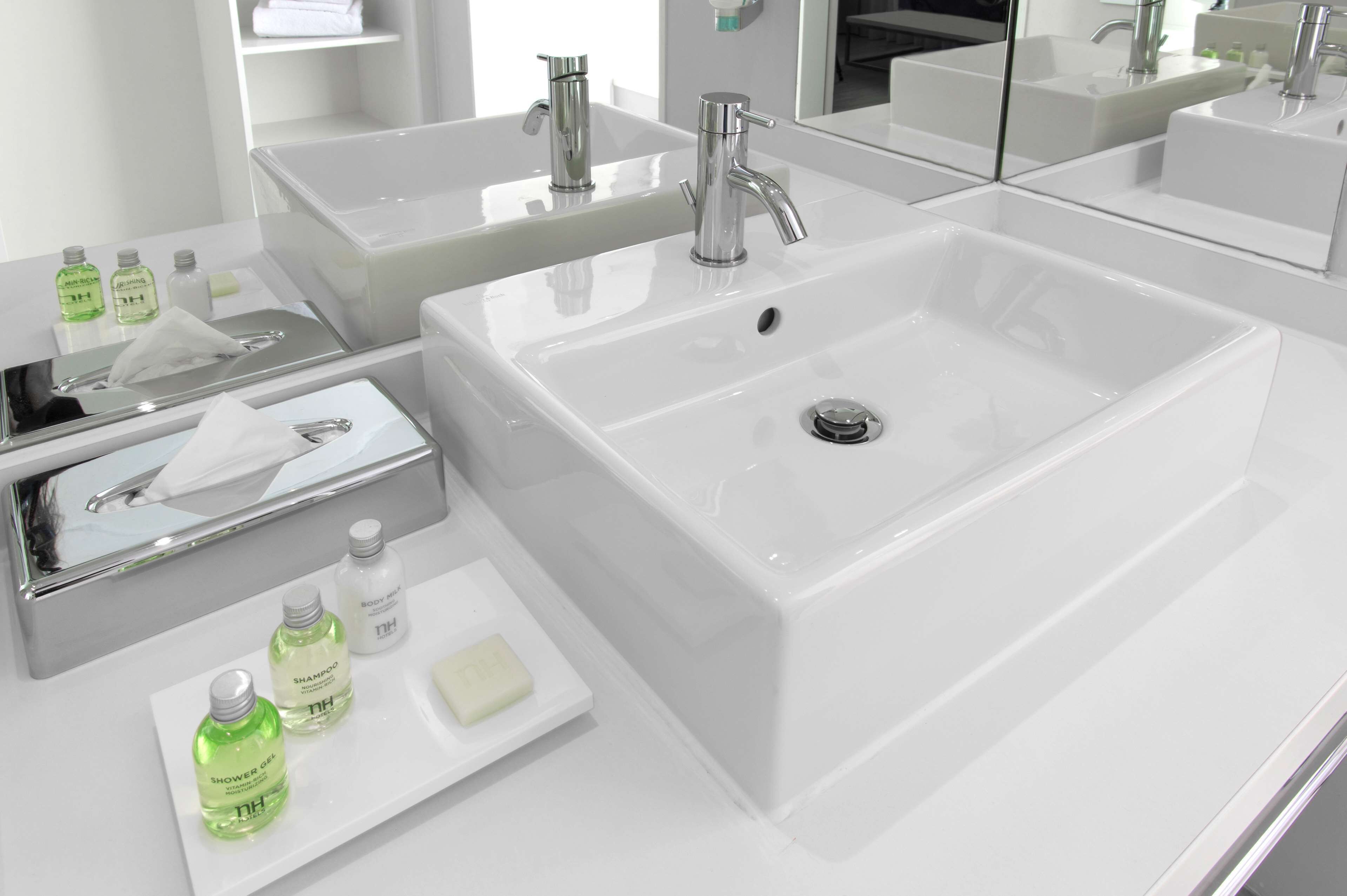 deep-soaking bathtub, rainfall showerhead, eco-friendly toiletries