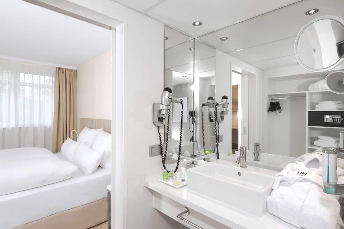 deep-soaking bathtub, rainfall showerhead, eco-friendly toiletries