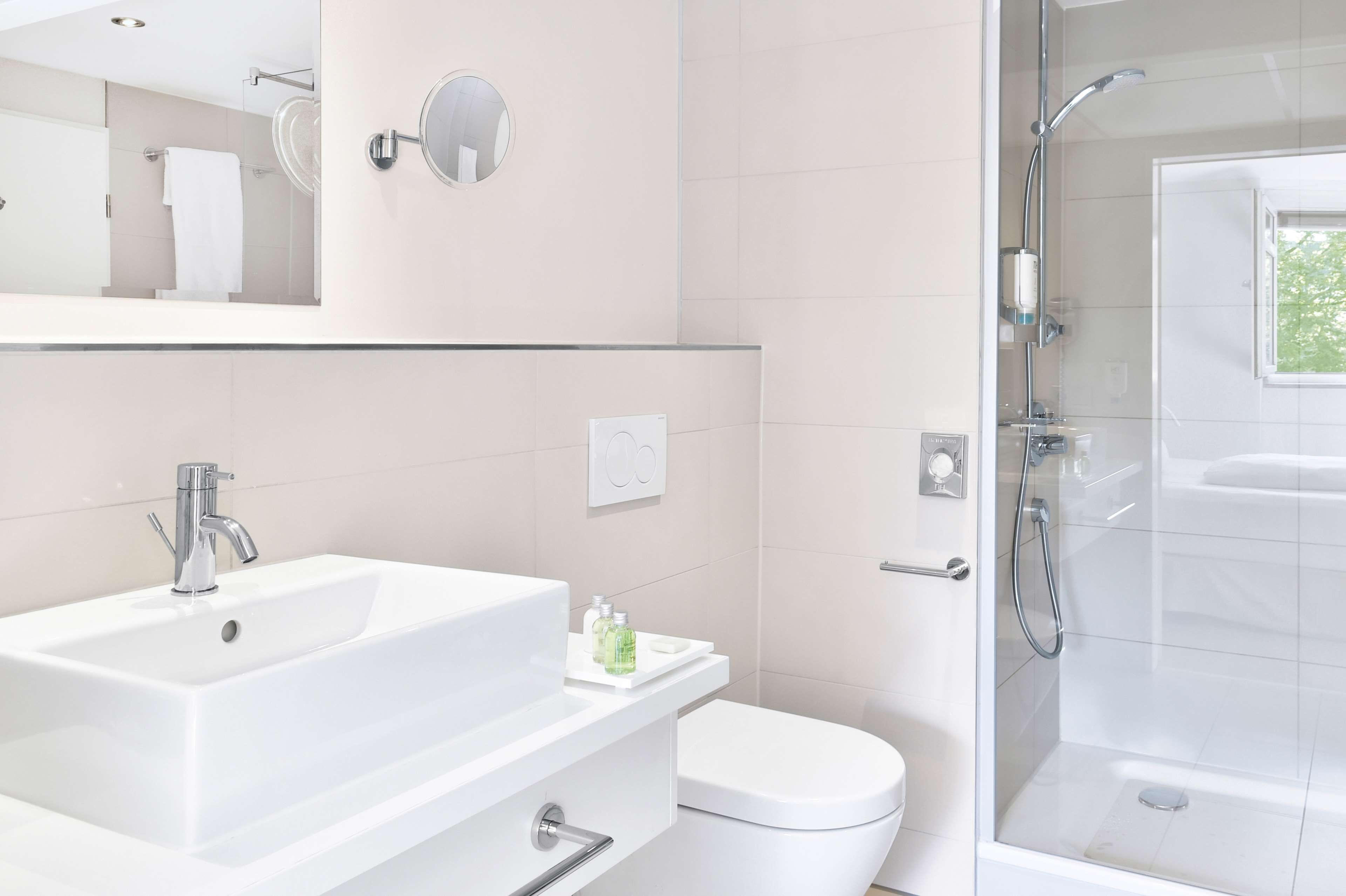 deep-soaking bathtub, rainfall showerhead, eco-friendly toiletries