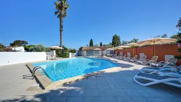 Seasonal outdoor pool, open 10:00 AM to 7:30 PM, pool umbrellas