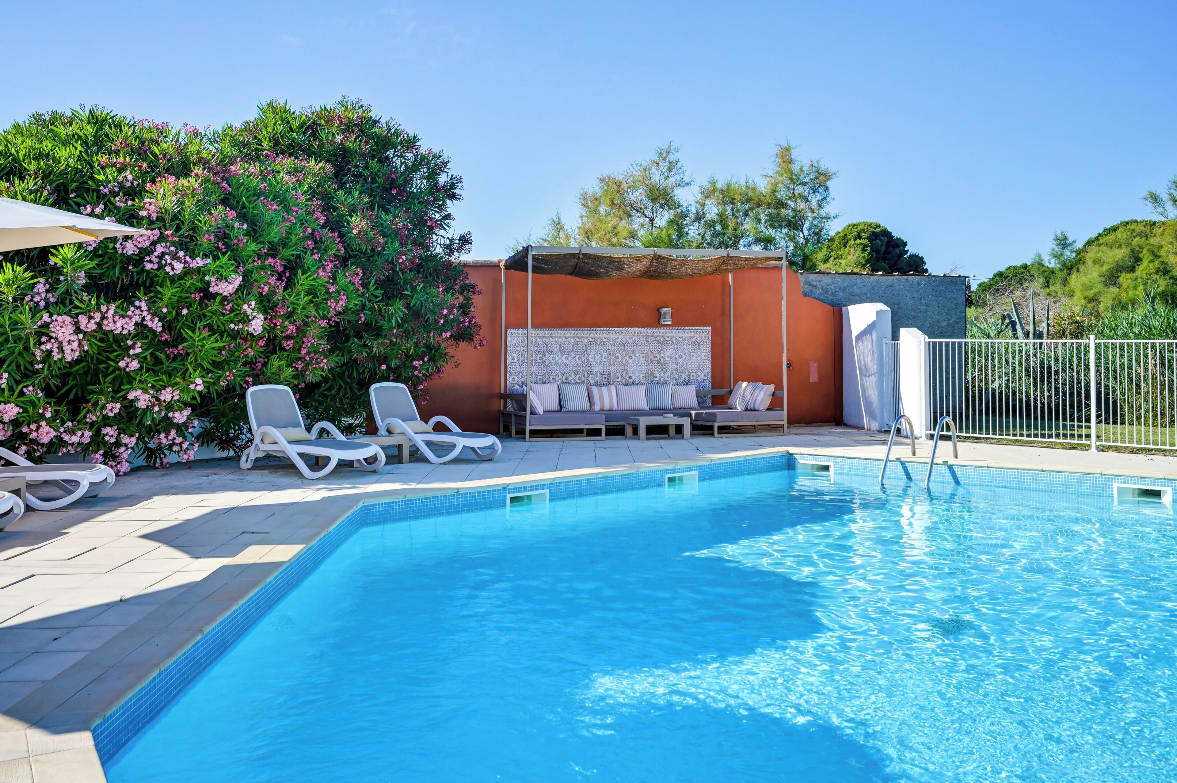 Seasonal outdoor pool, open 10:00 AM to 7:30 PM, pool umbrellas