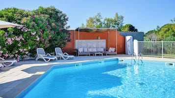 Seasonal outdoor pool, open 10:00 AM to 7:30 PM, pool umbrellas
