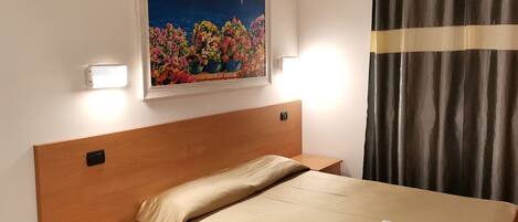 Economy Double Room | Down comforters, minibar, in-room safe, desk