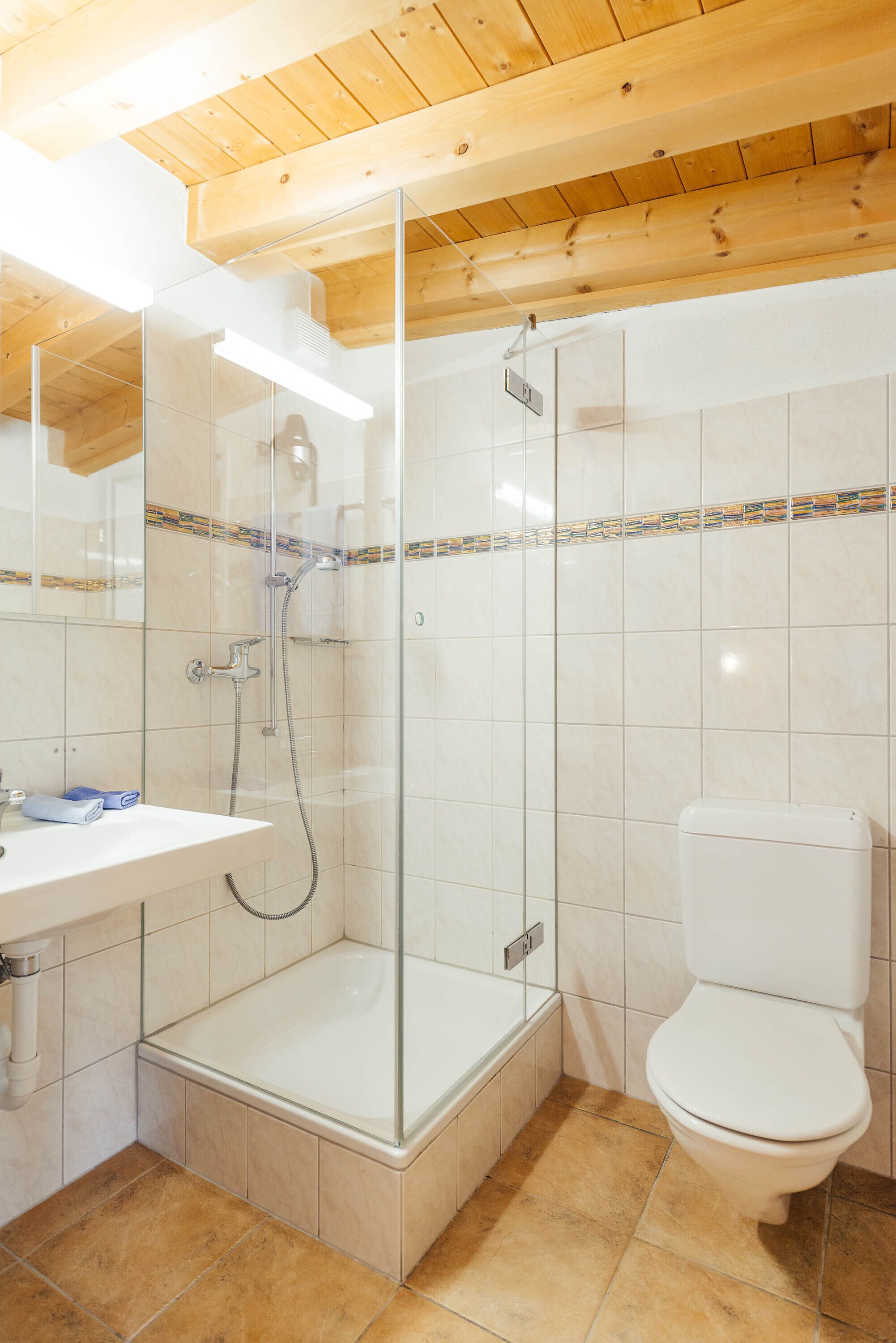 standard double room (pacific) | bathroom | shower, free toiletries, hair dryer, towels