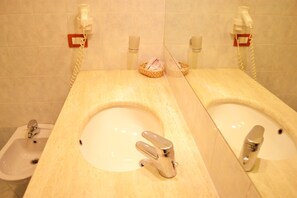 Shower, free toiletries, hair dryer, slippers
