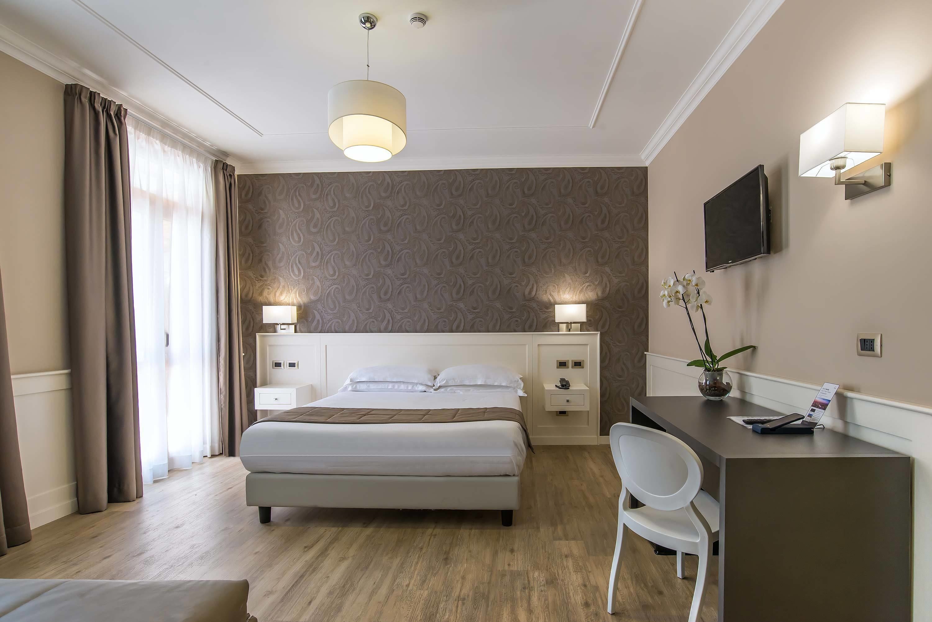 deluxe room | in-room safe, desk, blackout curtains, free wifi