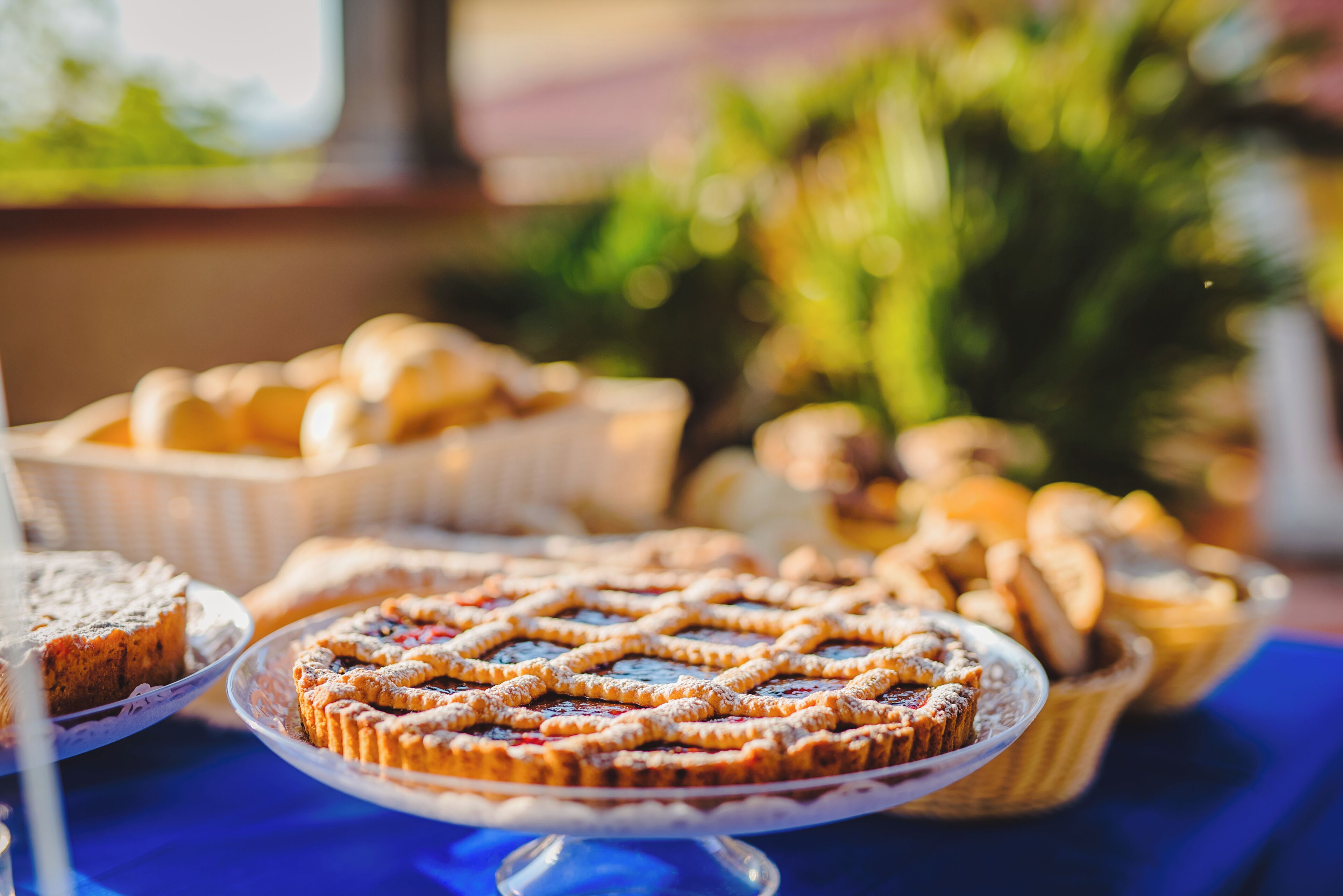A dessert table with various pastries and cakes.