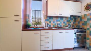 Apartment, 2 Bedrooms | Private kitchen | Coffee/tea maker