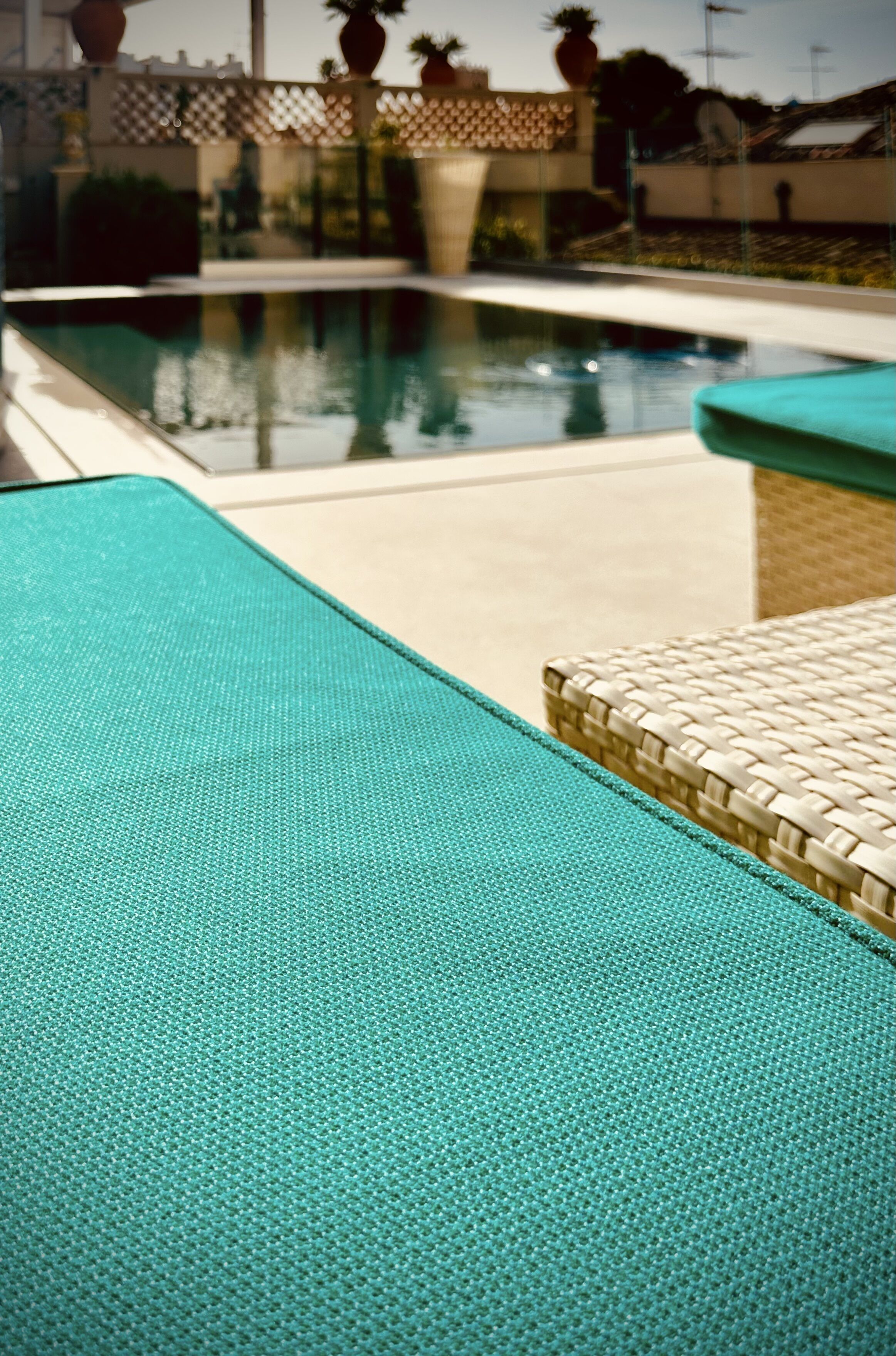 outdoor pool, open 9:00 am to 8:00 pm, pool umbrellas, pool loungers