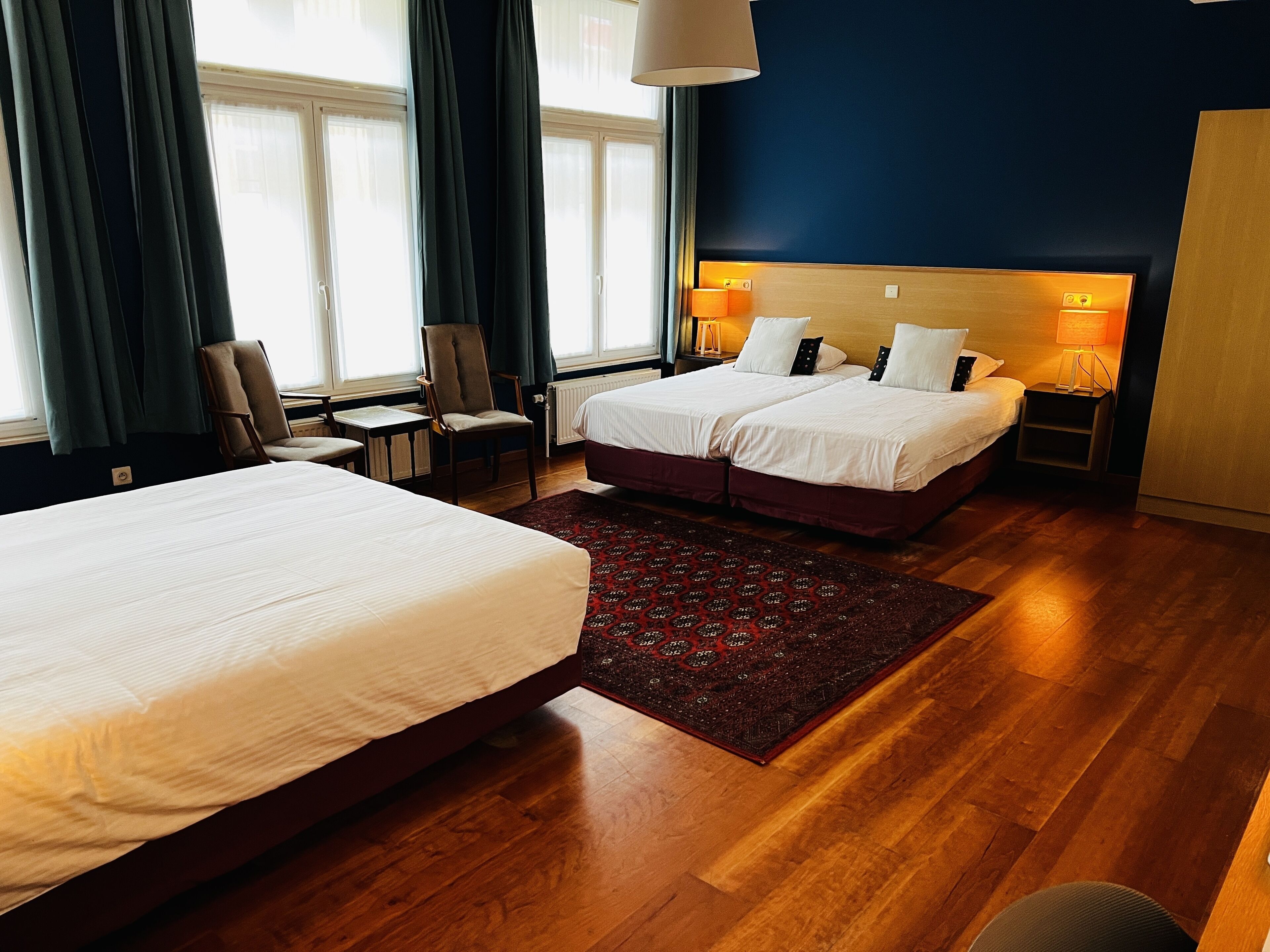 classic quadruple room | premium bedding, in-room safe, desk, laptop workspace