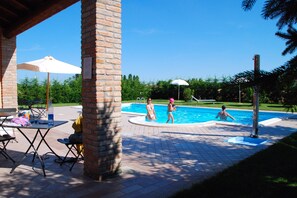 Outdoor pool, pool umbrellas, sun loungers