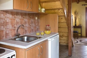 Quadruple Room | Private kitchen | Fridge, coffee/tea maker