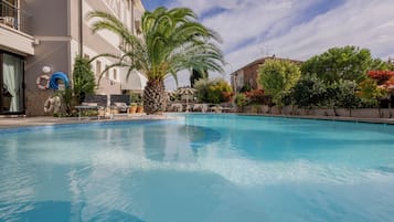 Outdoor pool, open 9:00 AM to 8:00 PM, pool umbrellas, pool loungers