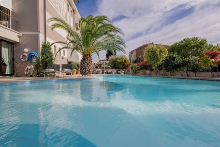 Outdoor pool, open 9:00 AM to 8:00 PM, pool umbrellas, sun loungers